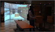Figure 1: A picture showing a user who is training on shelving skills in a virtual warehouse environment. The user trains on fulfilling orders and deliveries subtask by interacting with tangible tracked boxes. Accompanying virtual projections of the real boxes are shown in the virtual world. 