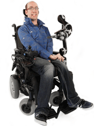 Figure 1: A picture of a user in a power wheelchair equipped with a JACO robot. 