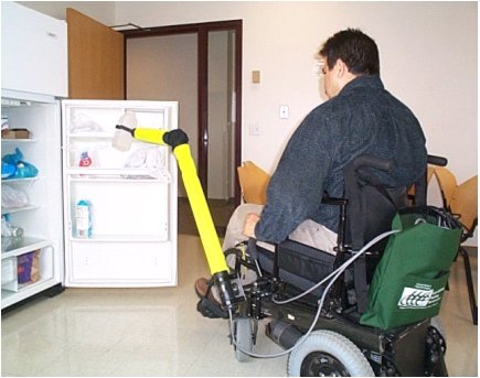 Figure 1 shows a subject using the WMRA to pick up a pitcher from the refrigerator shelf. 