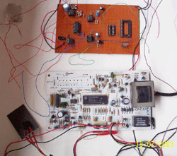 This picture shows the printed circuit boards of the transmitter, receiver with the timing circuits of the remote mouse. Relays are used to latch the users input for a predetermined time with the help of timer circuits. 