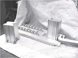 Image shows the components of the caster lock mechanism. 