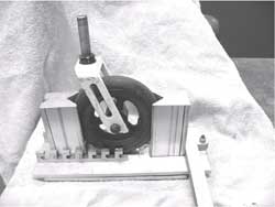 Image is a view of the caster lock mechanism with a caster installed 