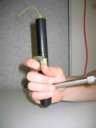 This photo shows a trigger mount that is rounded to the contour of a finder.  The switch is located at the bottom of that contour.  Both switches are mounted to the hollow tubing portion of the handle.