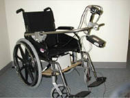 The bottom of Figure 1 shows the camera and laser mounted on a manual wheelchair with the help of a bar attached to the wheelchair’s armrests. The camera and laser are centered vertically with a distance between them of 40cm.