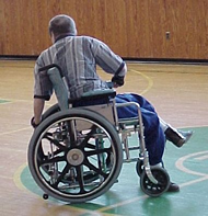 Client propelling himself in his manual wheelchair 