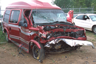 The vehicle damage in case WC-001 extends across the entire front end of the 1992 Ford Econoline van, with the maximum crush of 69 cm located at the center front.