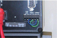 Image shows two jumpers connected between input and output ports on the backside of the camera