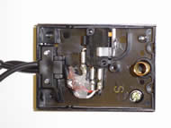 Photo 4b: Finished Pedal – Cover Open  Image shows the overhead view of the SPDT pedal with cover removed. External cables lead into the pedal and connect to an SPDT switch with three connection ports. A spring located at the pedal base returns the pedal to its original position. 