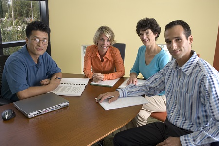 Four RESNA Members sitting around a table