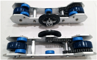 Photographs of the assembled system include two separate roller units and two front wheel support stands, with visible details including blue drive and lateral support wheels, two chain drives in each unit, and secure attachment of small barbell plates. 