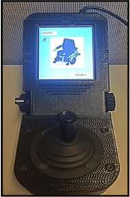 Figures 8 and 9: On the left is a top view image of the assembled MEBotv2.0 User Interface with Home Screen.  The home screen contains a black CAD model of the MEBotv2.0 with a blue background.  This image shows the joystick, mode select switch, potentiometer, and connecting bolts as viewed when looking down at the interface. On the right is an image of the inside of the assembly showing the LCD screen, microcontroller, potentiometer, mode select switch, and joystick. 