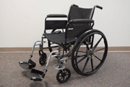Electronic actuator installed on the left caster wheel of a folding manual wheelchair to enable one arm drive.