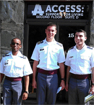 The team members (Cadets Matchoumboud, Sheikh, and Westrom) stand in front of Access: Supports for Living, a non-profit organization that employs workers with disabilities.
