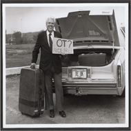 This photograph was taken of Sammons during an AOTA conference in the 1960’s. Sammons is standing behind a parked car with the back trunk open. In his left hand is a cardboard sign that reads “OT? RIDE FREE”. To his right is a large suitcase. Sammons is known for offering rides to AOTA conference attendees from the airport to the convention site. Many photographs are documented in the web archive database to show Sammons throughout his business endeavors. 