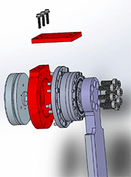 Close-up of the hip joint mechanism. The part in the outer position is a metal part that is capable of moving the harmonic drive by the user. In the highlighted red part, a rounded component that holds the harmonic drive and is attached to the frame by another highlighted red part that is flat and rectangular in a horizontal position. This part is attached to the rounded parts by 3 screws. The next component to the right is the harmonic drive that is held in the red part. This is attached using screws all around the drive. Finally the harmonic drive is attached to the leg extension by 8 screws arranged in a circular position.