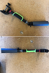 The first picture shows a 1.5 inch diameter therapist handle, 6 inches long. Joint that has a twist lock that attaches therapist handle to metal rod. Silicone overhand grip attached to metal rod for client grip support. The second picture is the same device, but at 180 degree angle. 1.5 inch diameter therapist handle, 6 inches long. Joint that has a twist lock that attaches therapist handle to metal rod. Silicone overhand grip attached to metal rod for client grip support. Metal vise clamp that twists to tighten.