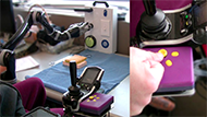 Figure 2 shows the control interface and ARM mounted on the participants’ wheelchairs. The JACO arm is mounted on the left side of the wheelchair and the purple control interface is installed next to the wheelchair controller. The individual with cerebral palsy is sitting in the wheelchair with the forearm resting on the control interface shell and the right thumb touching the joystick knob.