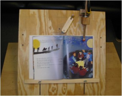 The proof of concept prototype is a wooden base plate 24 inches by 24 inches.  There is a rubber wheel on a dowel that sits in the upper right hand corner of the page when a book is placed on the base plate.  A disk-shaped Plexiglas cam with a hook protrusion is centered over the spine of the book to constrain and turn the pages.