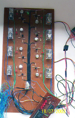 This picture shows the printed circuit boards of the transmitter, receiver with the timing circuits of the remote mouse. Relays are used to latch the users input for a predetermined time with the help of timer circuits. 