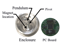 Figure 2 is a close-up photograph of the miniature data logger taken apart. On the left is the aluminum housing with the pendulum exposed. On the right is the printed circuit board. 