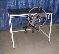 This photo shows the hardware system including steering column and hand controls mounted to a table top.