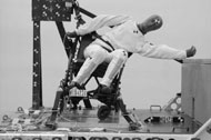 Figure Two shows the post-test side view photos of the dummy and wheelchair’s final position after each of the three tests.  In all tests the wheelchair is upright and similar to the pre-test photos.  In all the photos the ATD is leaning to its left with a torso angle of approximately 45 degrees for test A, 100 degrees for test B, and 15 degrees for test C. 