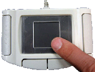 Figure 4: EdgeWrite on a Synaptics TouchPad with a plastic template with a square hole. 