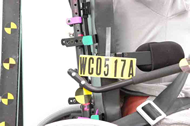 This figure shows the right-side seatback detachments that resulted from the test of planar seat B installed on the commercial wheelchair base.  Both the top and bottom seatback hooks slid out of their respective retaining brackets and detached from the seatback post.  