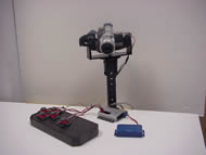 This photo shows a prototype camera mount and the control interface that allows a person with cerebral palsy to independently operate a video camera.  