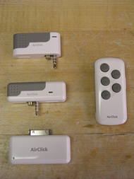 This photograph shows the AirClick wireless ipod controller as it comes out of the box. Also shown are three different adapters that fit different ipod models.