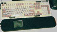 The picture showed how the PDA was set up in relation to the keyboard. The PDA was embedded in a foam wrist rest. It was located off centre and below the letter keys of the keyboard.