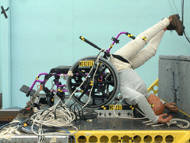 This figure shows two post-test images of wheelchairs that have been tested to the proposed rear-impact standard.  Both wheelchair have catastrophic seatback failures and show the crash test dummy no longer seated in the wheelchair. 