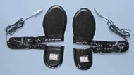 This figure shows a pair of B&L Engineering Footswitches used in the iGait device (4).  The wires shown on the sides connect to the iGait interface. 