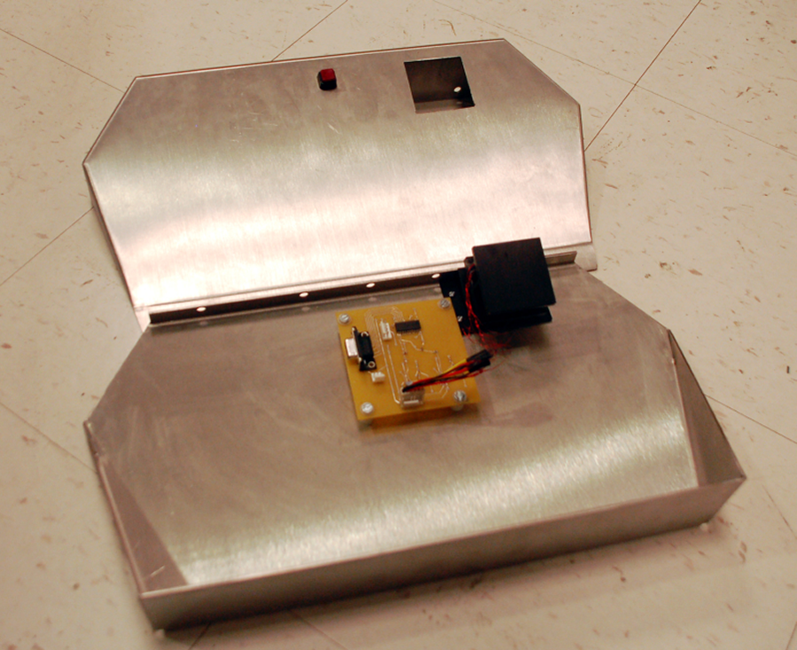 Figure 4 combines our printed circuit board, sensor block and steel footplate into one integrated piece.  The footplate is left unscrewed so that the other components are visible.   