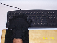 Figure 1. Final Prototype showing the glove and platform attached with a keyboard as a reference. 