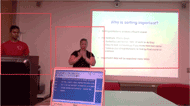 Figure 1 shows a video of a classroom with a teacher in the top left, an interpreter in the center, slides on the right and real-time captions at the bottom. Each of the above is outlined in a red box. 